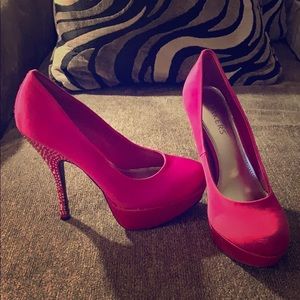 Pink pumps with rhinestoned heels